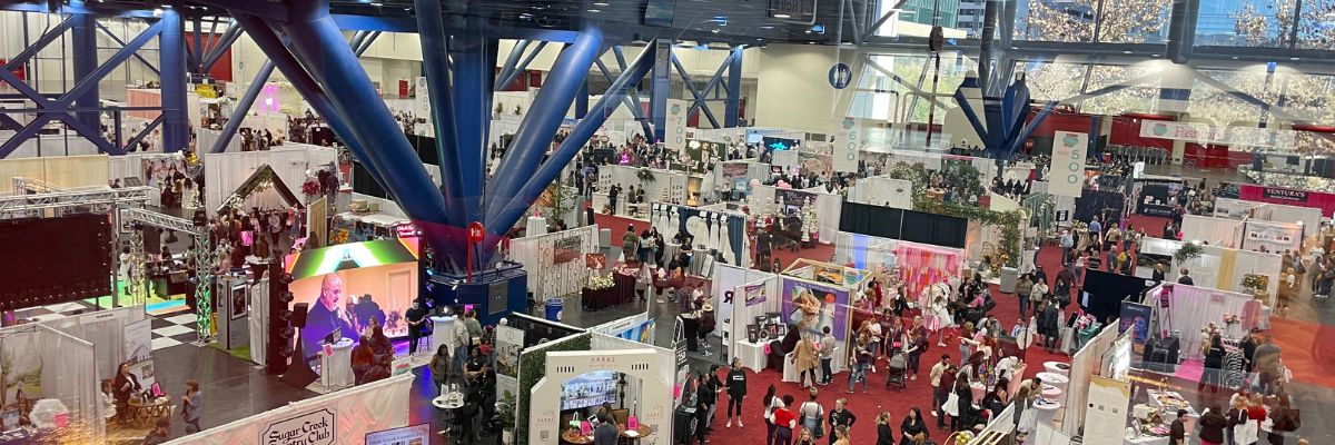 Picture from Bridal Extravaganza Show showing vendor booths and customers